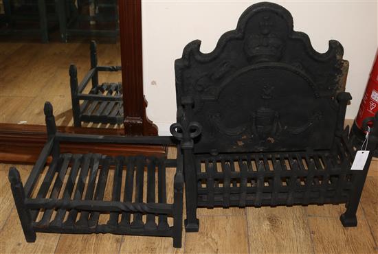Two wrought iron fire grates and a fire back, grates W.60cm and 4cm, fire back W.60cm